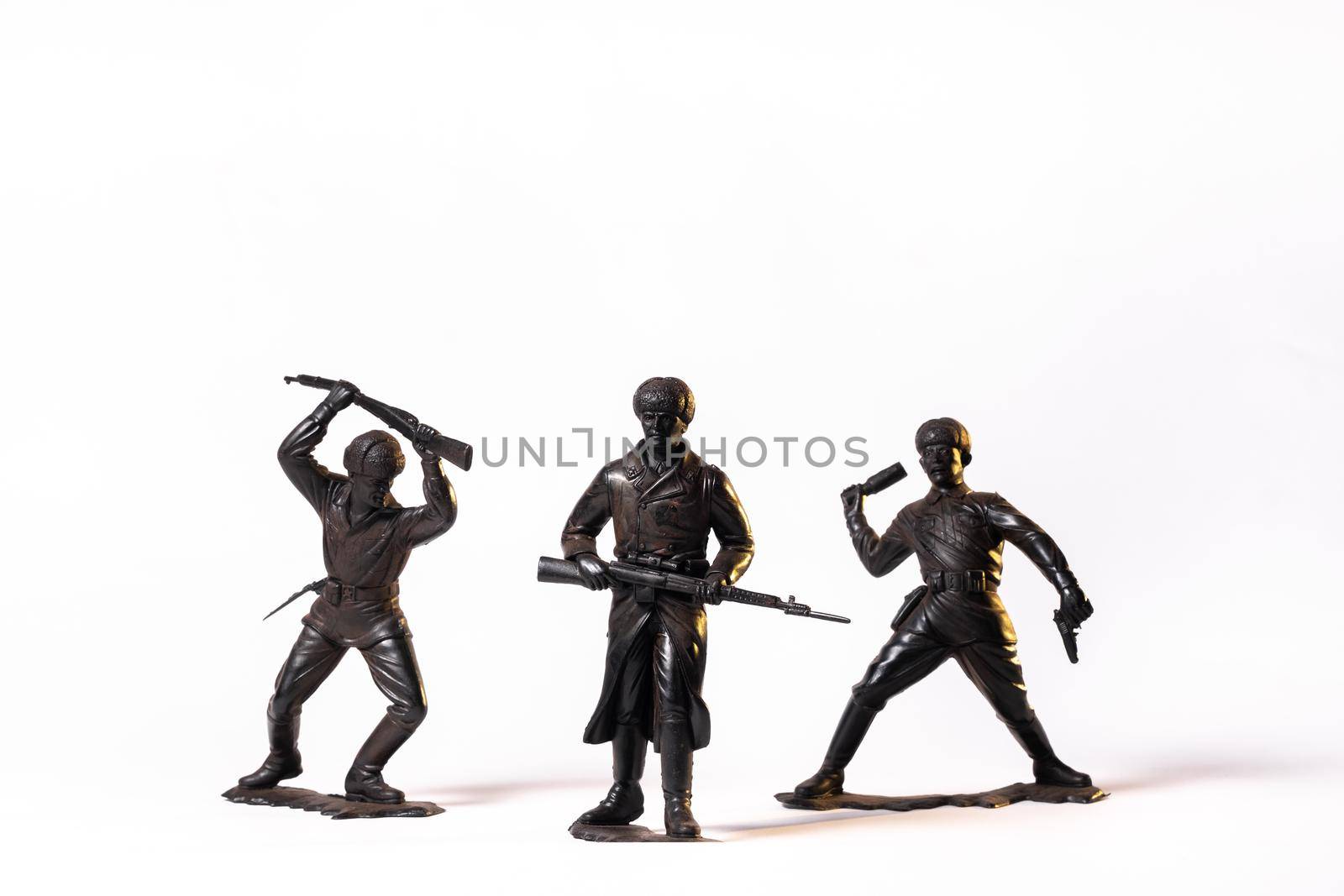 Vintage toy black soldiers isolated on white background.