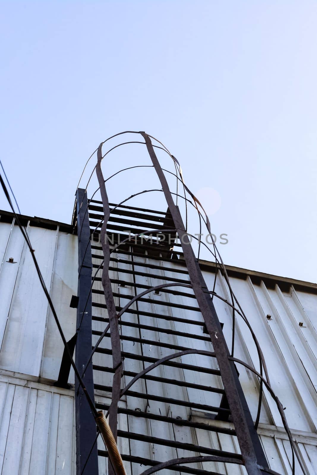 Fire metal staircase on a building wall close up