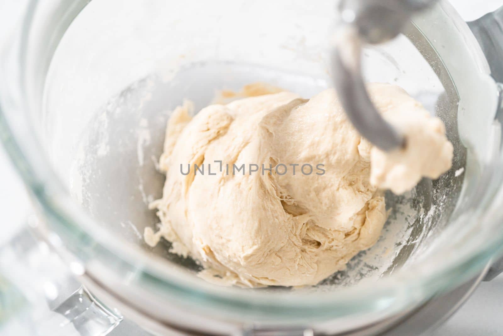 Mixing bread dough in a stand-alone kitchen mixer to bake patriotic cinnamon twists.