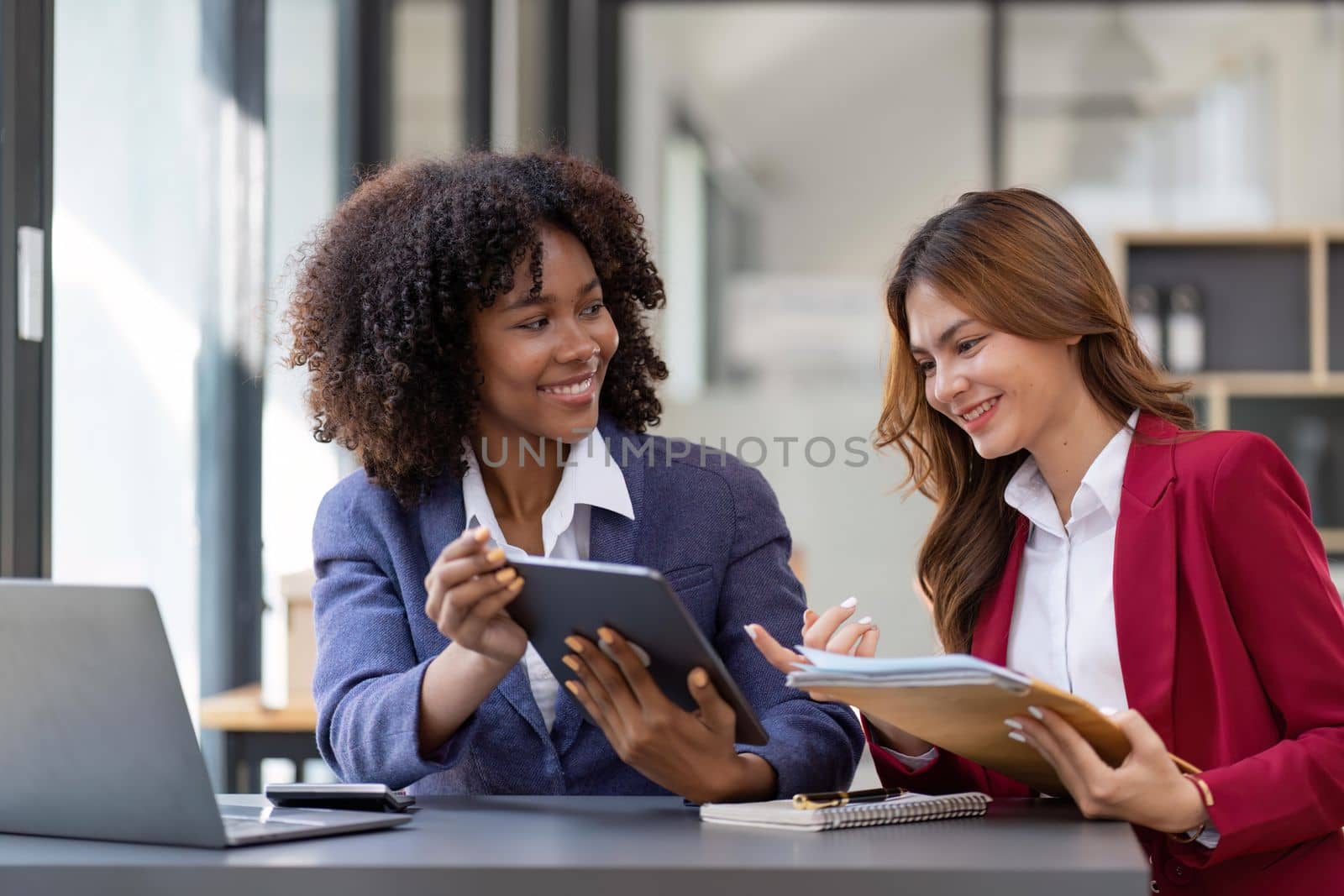 Teamwork of business people analysis graph Asian business woman advisor meeting to analyze and discuss on the financial report.