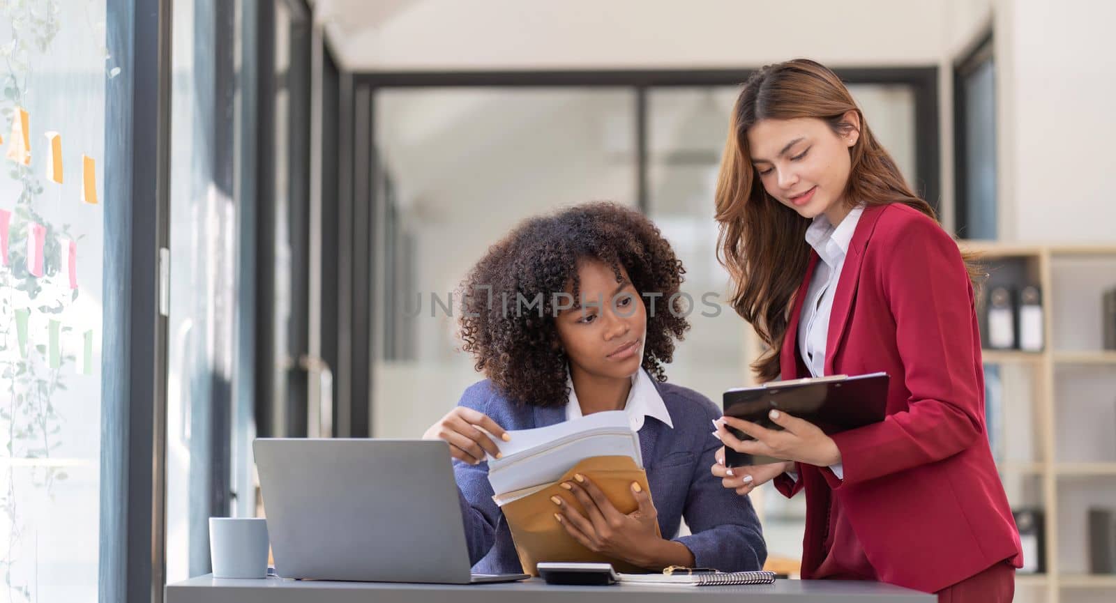 Teamwork of business people analysis graph Asian business woman advisor meeting to analyze and discuss on the financial report.