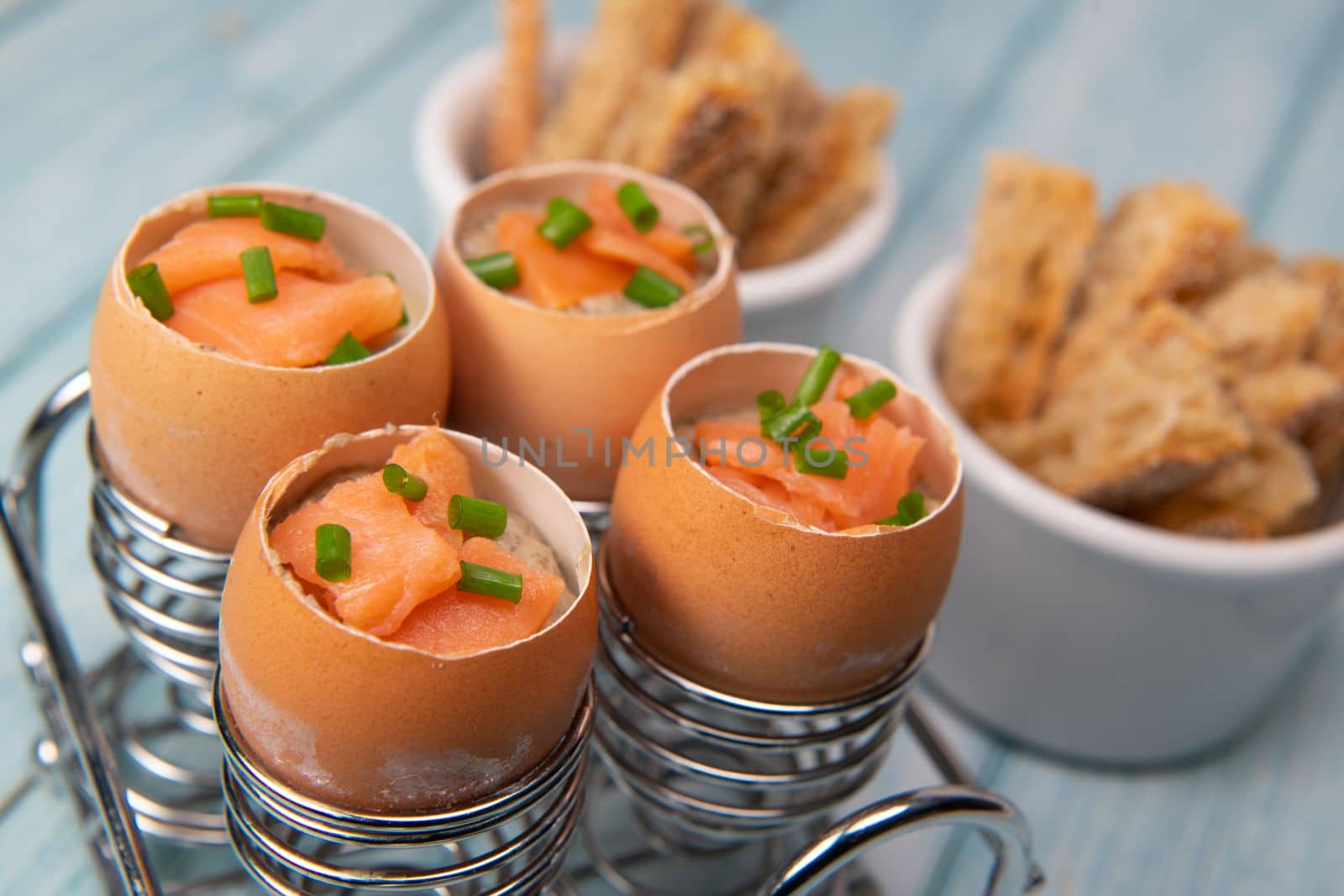Recipe eggs casserole cooked in the shell with mushroom cream sauce and smoked salmon, High quality photo