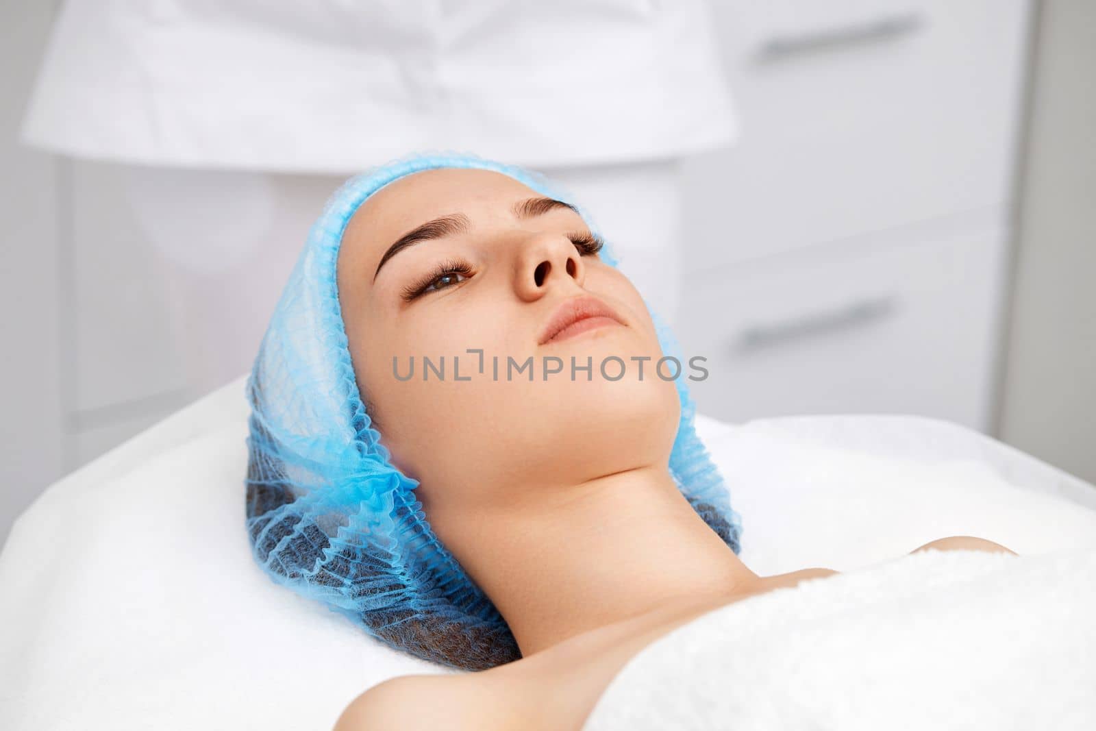 young beautiful woman at spa salon. female face with healthy smooth soft skin