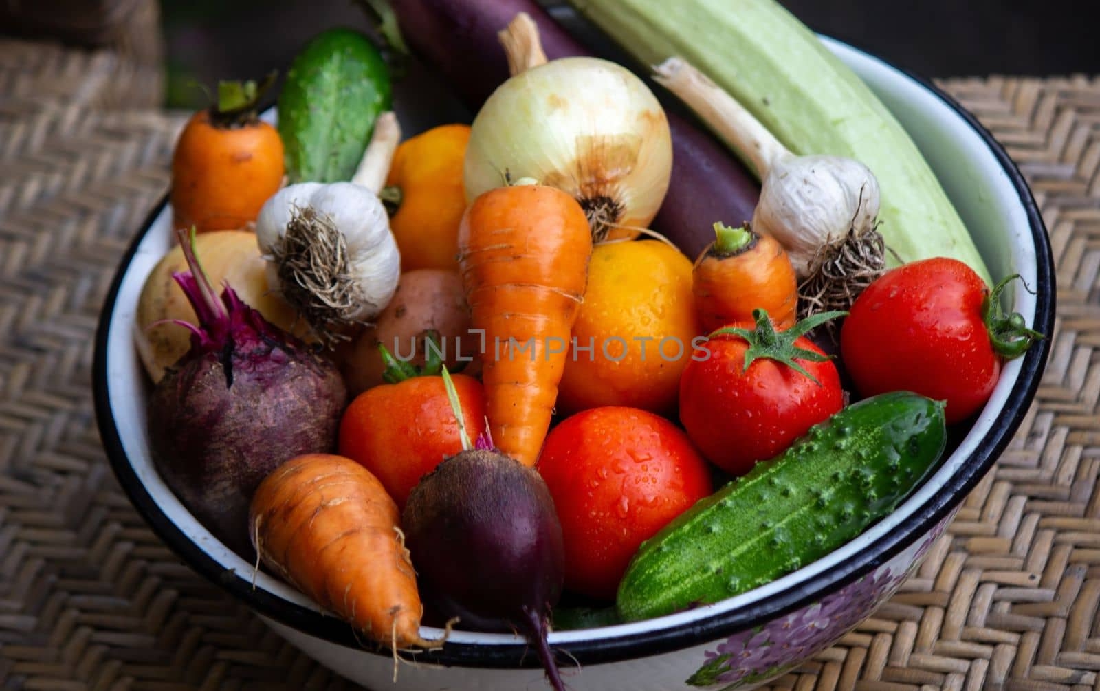 fresh picked vegetables in a bowl in the garden. Selective focus