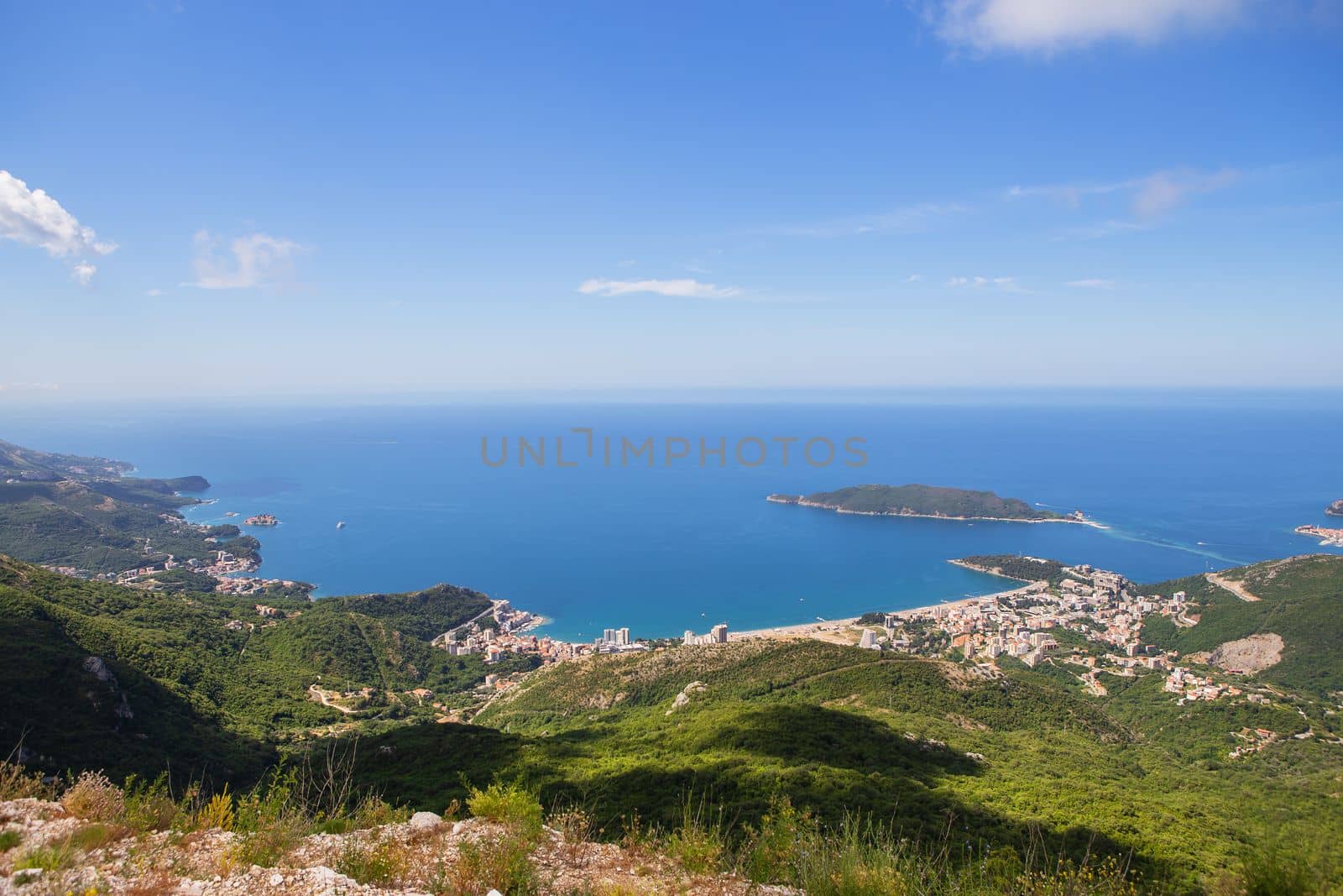 View of the city from the top of the mountain road. View of the coast and the city of Budva Riviera. Montenegro, Balkans, Adriatic Sea, Europe