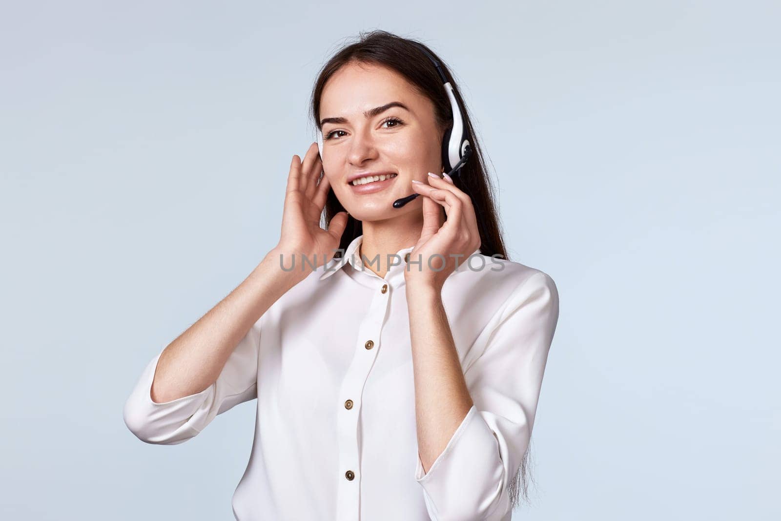 woman with headphones and microphone is consulting clients online. Call center, business people concept
