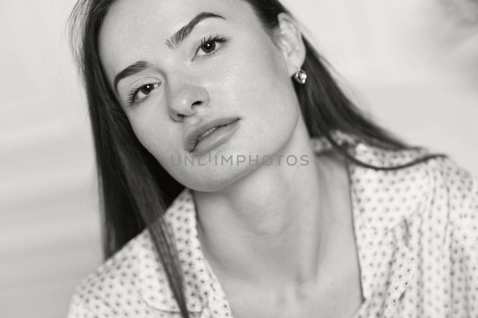 portrait of sexy brunette woman in pajamas. black and white