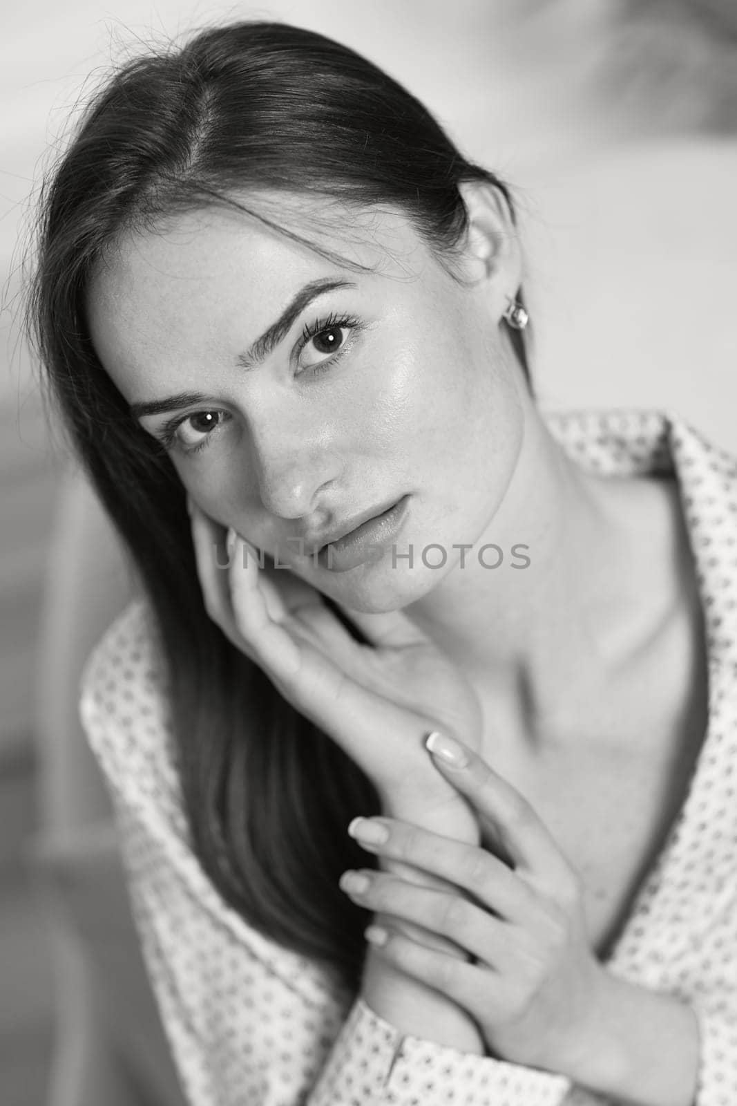 portrait of sexy brunette woman in pajamas. black and white