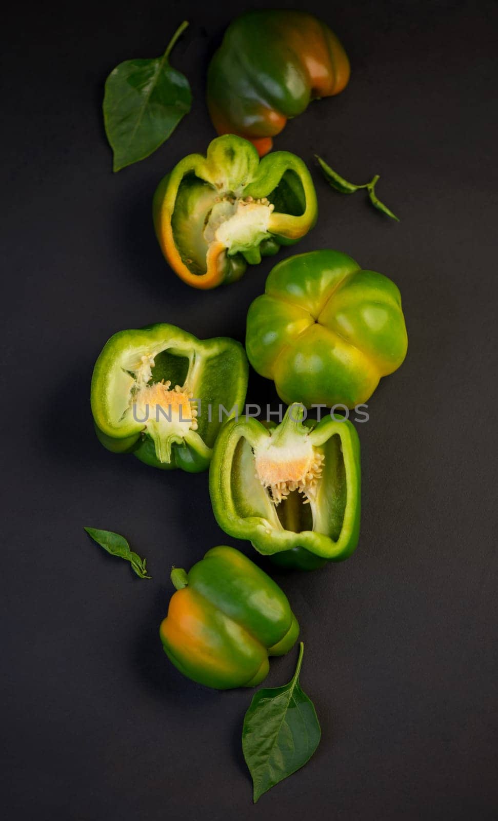 sweet pepper, green bell pepper on black background, full depth of field by aprilphoto