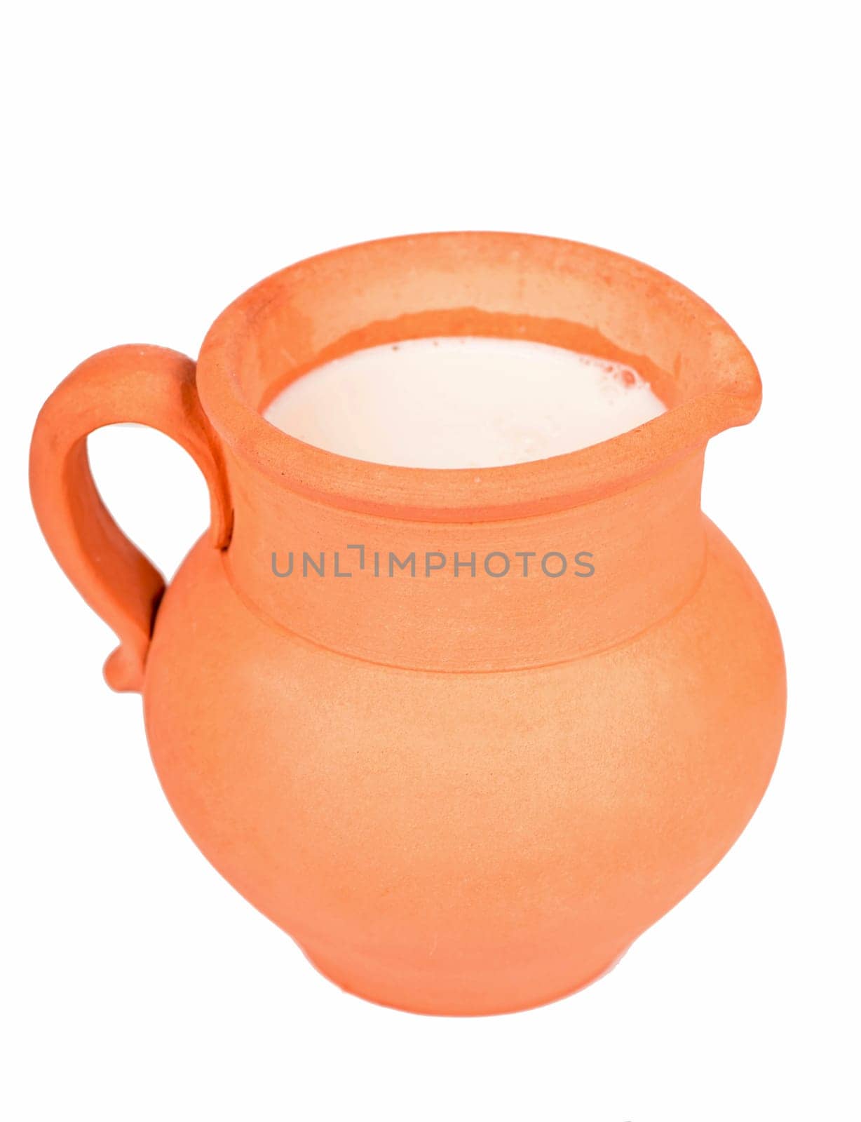 Clay jug with milk stands isolated on the white background by aprilphoto