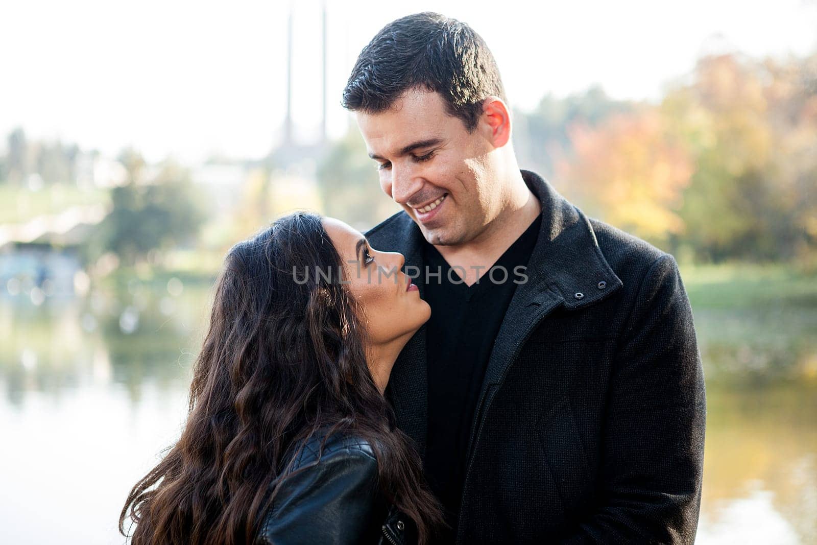 Happy in love couple walking in autumn park