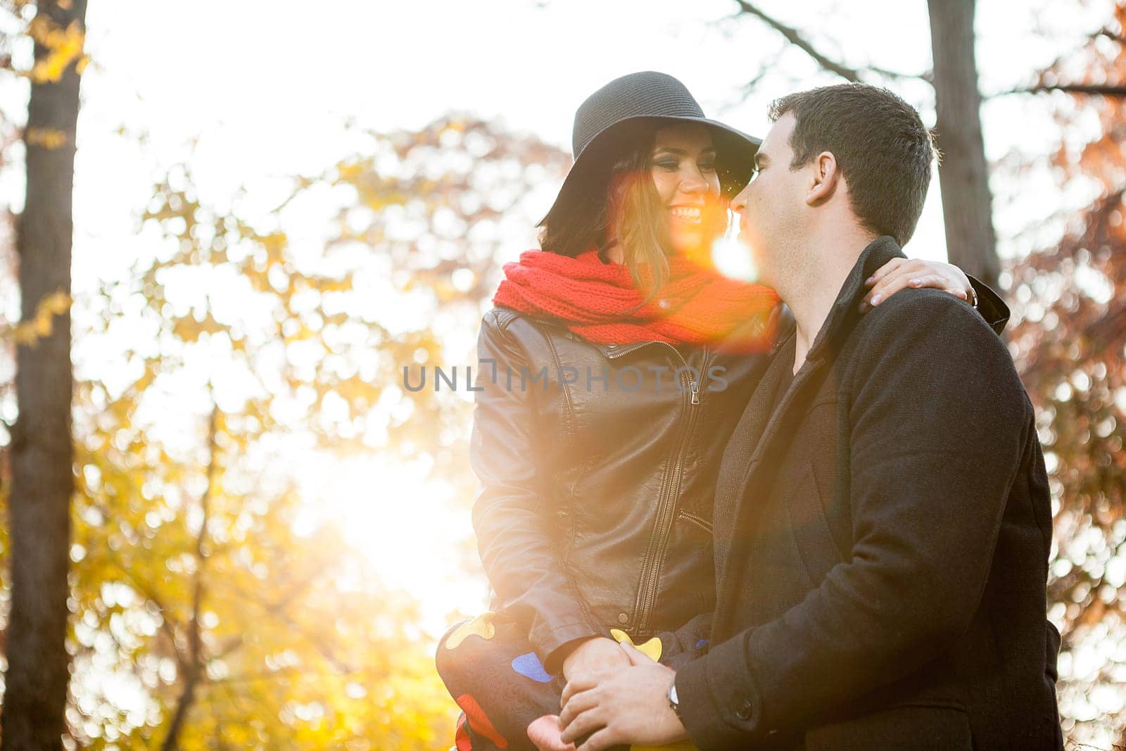 Beautiful gourgeous young couple in autumn park