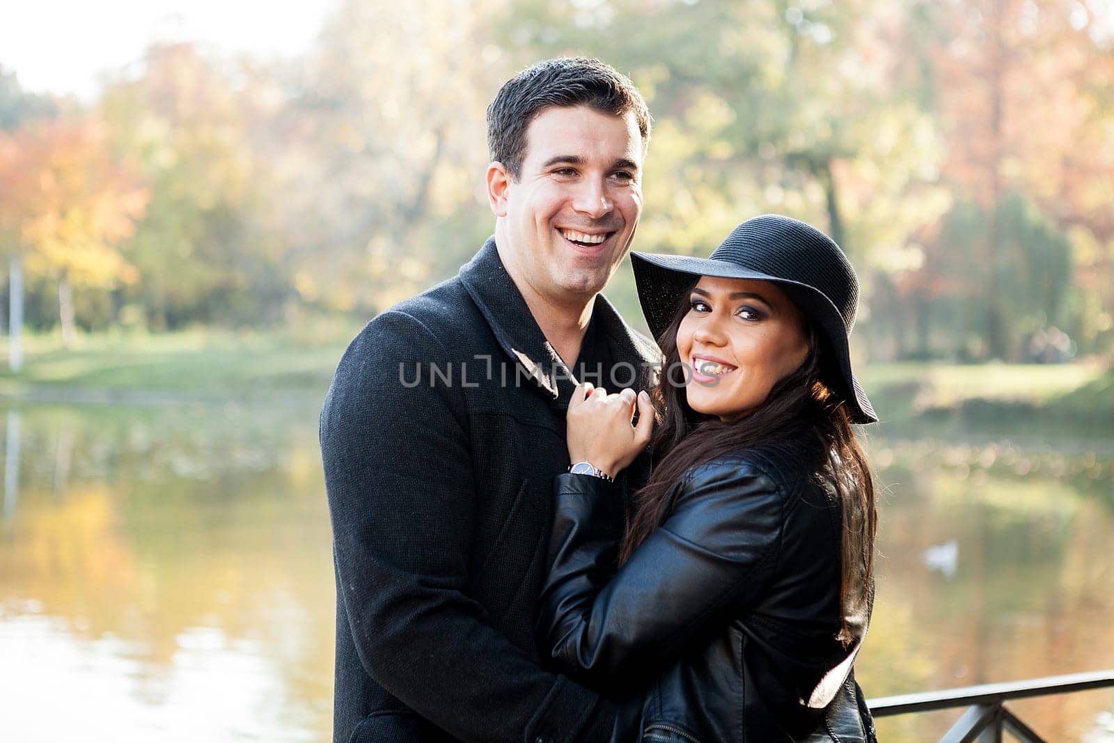 Beautiful gourgeous couple walking in an autumn park