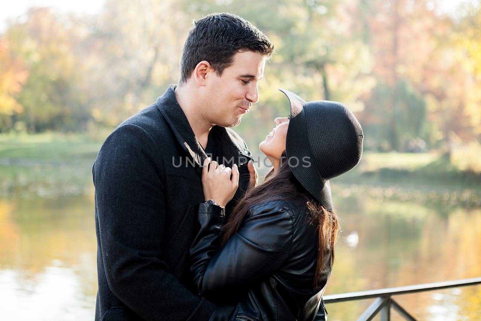 Beautiful gourgeous couple walking in an autumn park