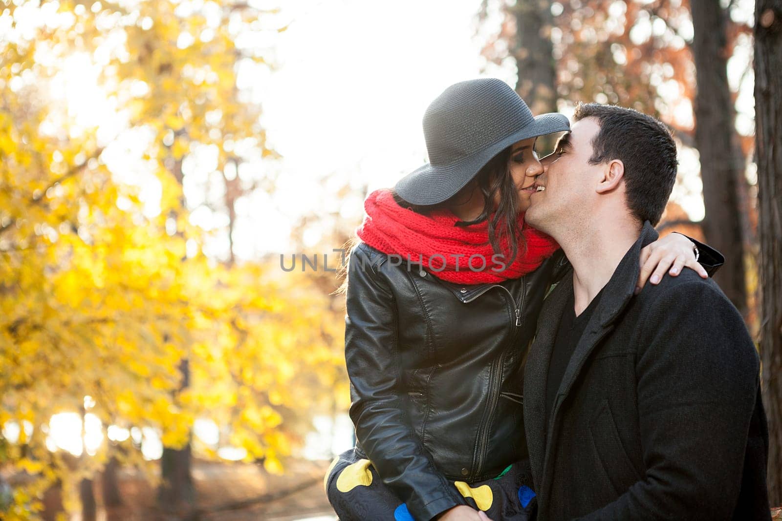 Beautiful gourgeous young couple in autumn park