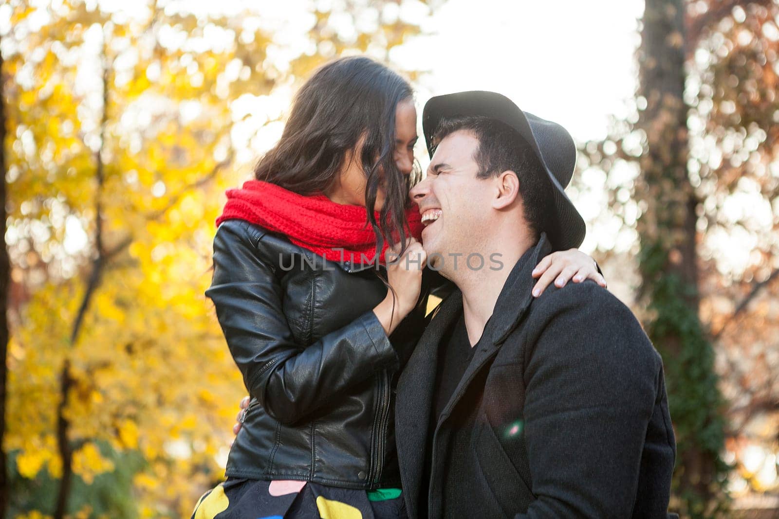 Beautiful in love happy couple in autumn park having fun