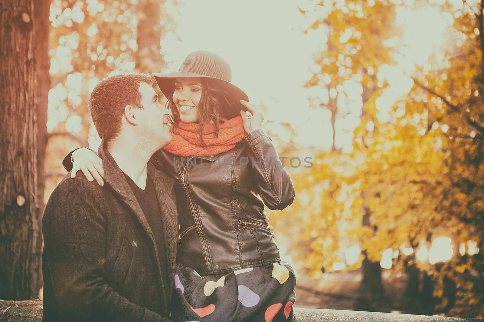 Beautiful gourgeous couple in autumn park having good time