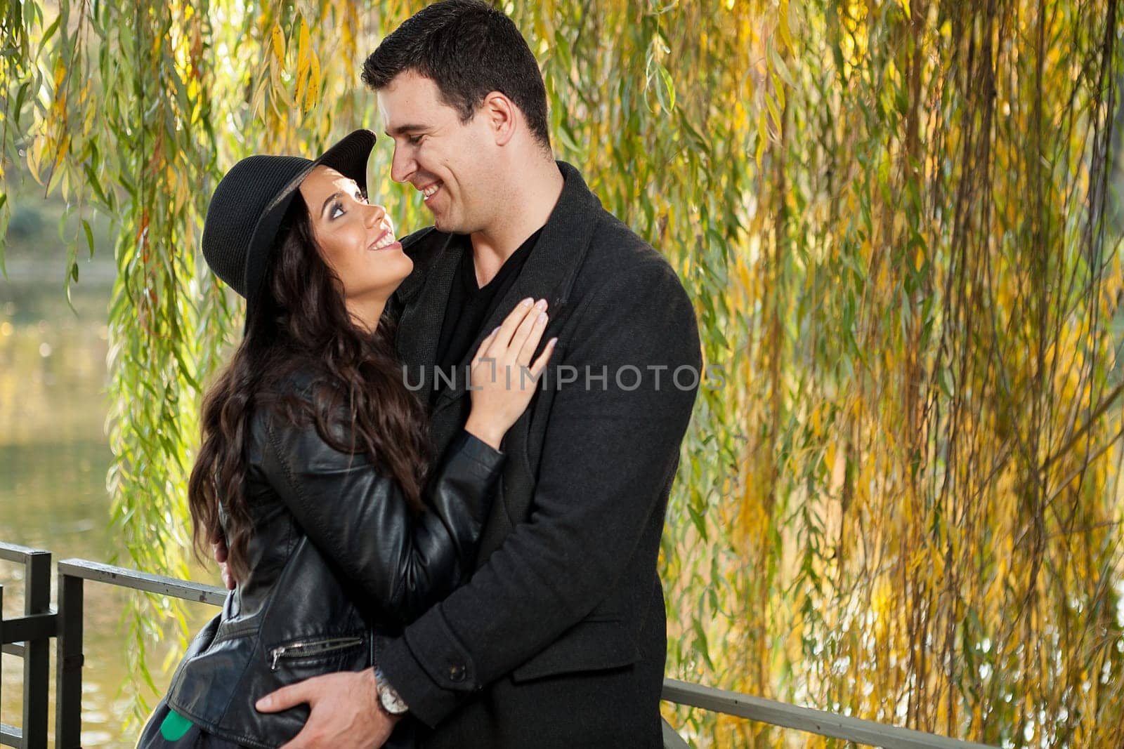 Beautiful in love couple walking in autumn park