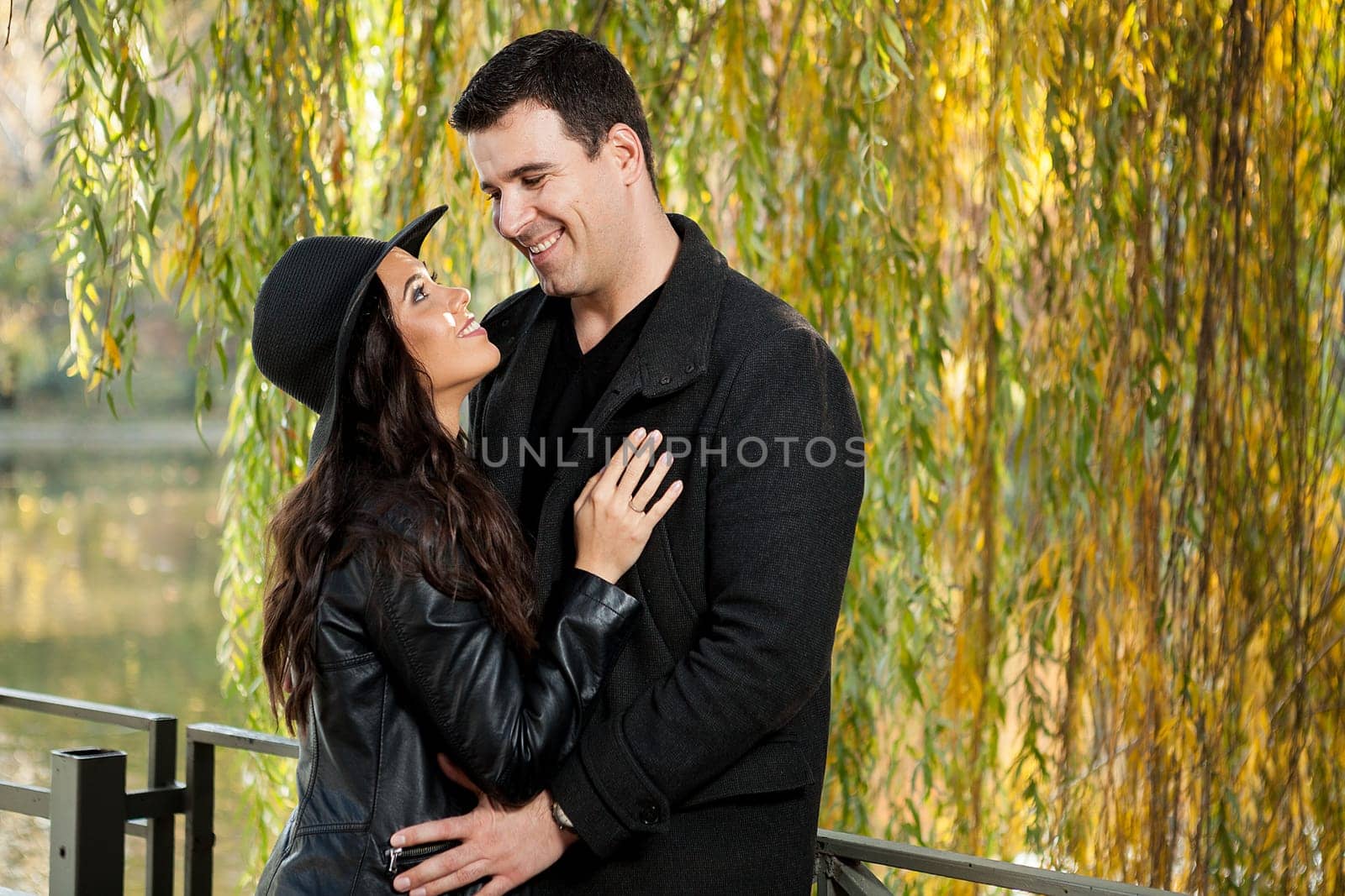 Beautiful in love couple walking in autumn park