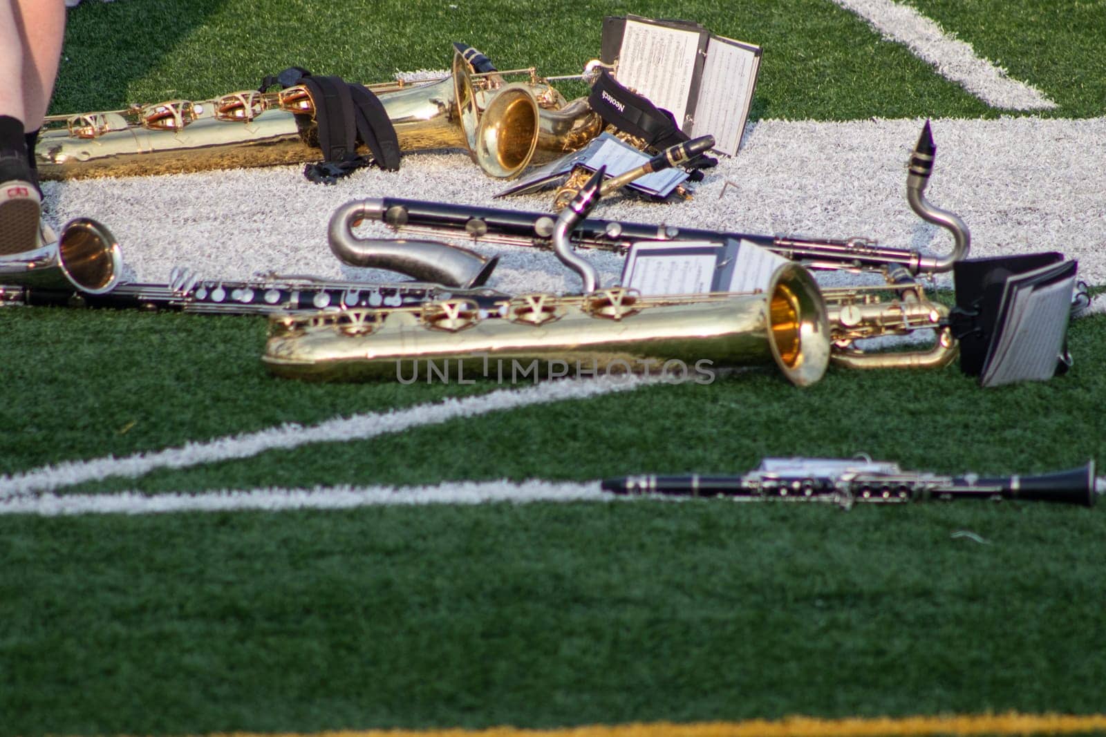 High school band instruments up close on foot ball field . High quality photo