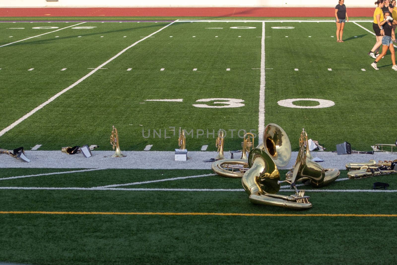 High school band instruments up close on foot ball field 30 yard line. High quality photo
