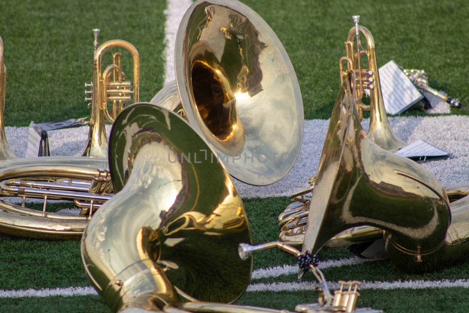 High school band instruments up close on foot ball by gena_wells