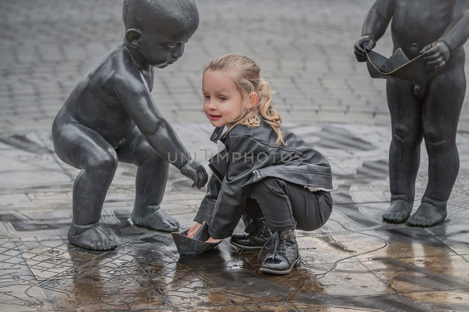 little girl playing in the square