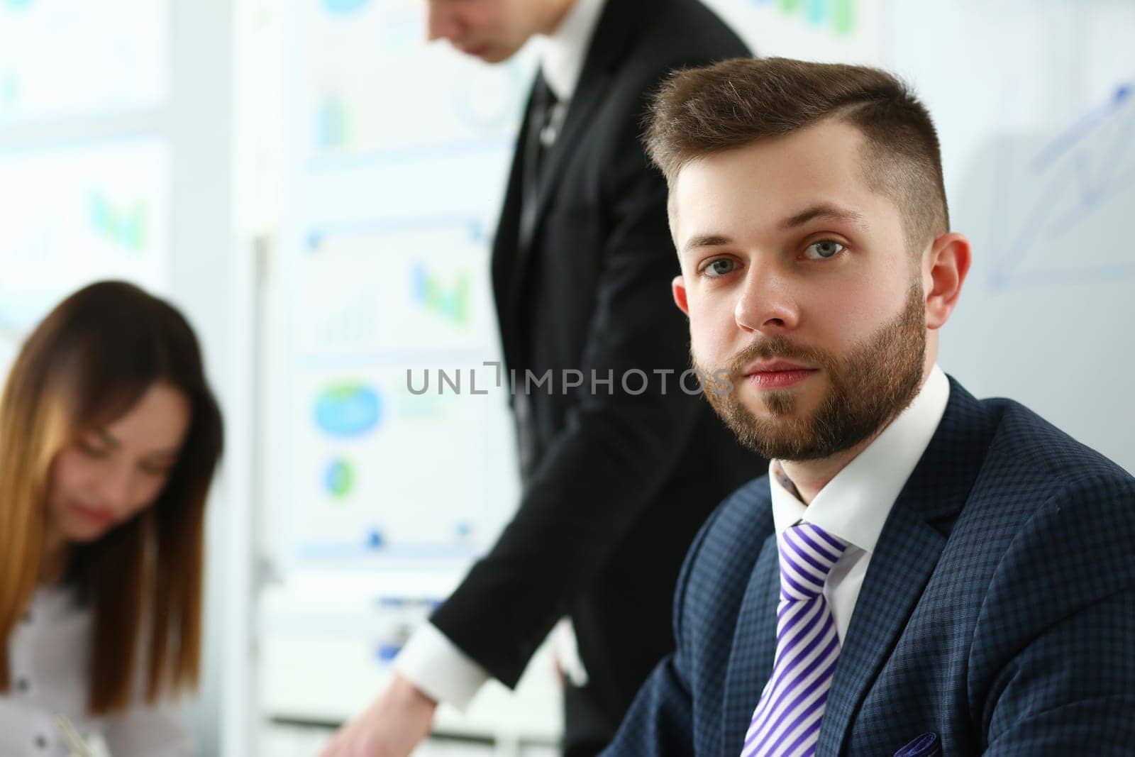 Portrait of leader with business team behind by kuprevich