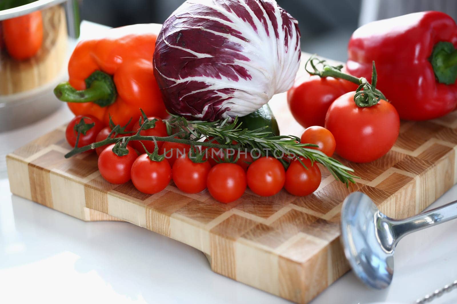 Fresh vegetables for salad with paprika red cabbage tomatoes and rosemary. Delicious fresh vegetable salad concept