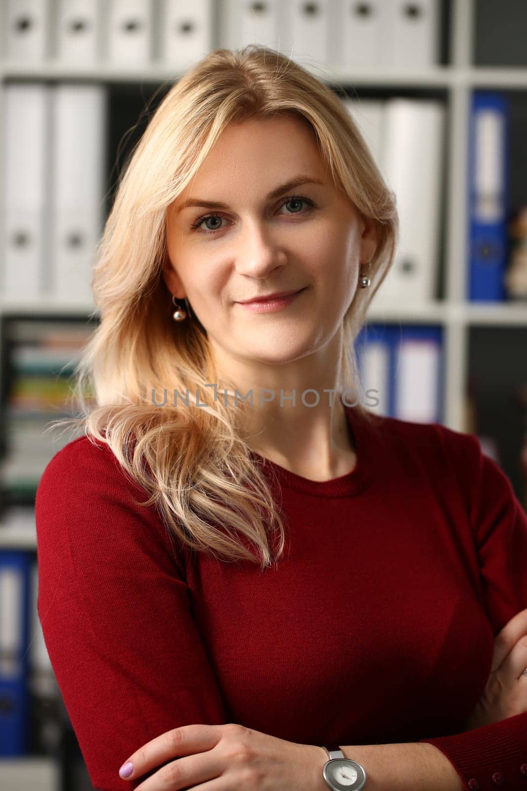 Smiling successful and attractive business woman in office. Business consultant manager marketer concept