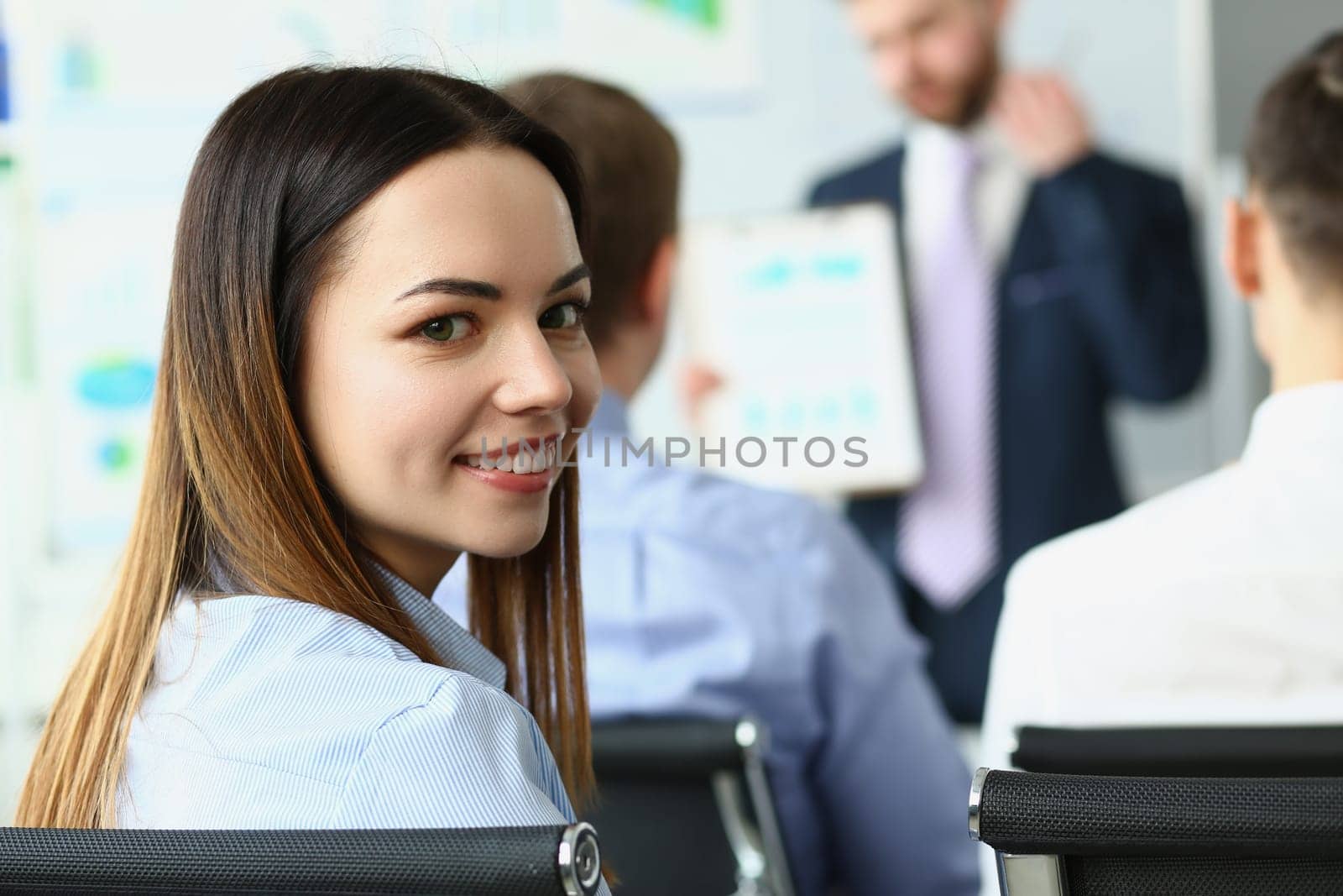 Audience listens to presentation at business conference on company development. Training marketing seminar concept