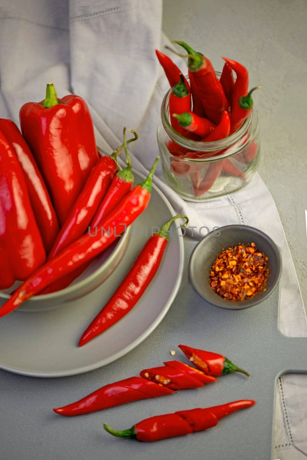 Grey background with chili pepper. Red, hot. Capsicum. Seasoning Spice Mexican