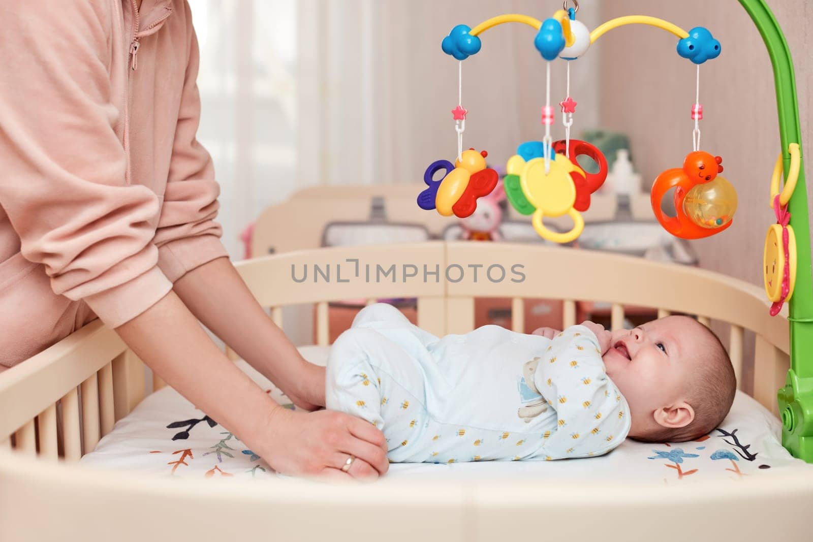 Baby massage. Mother doing gymnastics with her newborn child for healthy.