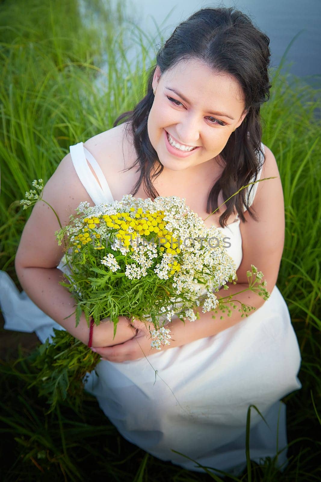 Portrait of Slavic plump chubby girl on the feast of Ivan Kupala with flowers on a summer evening by keleny