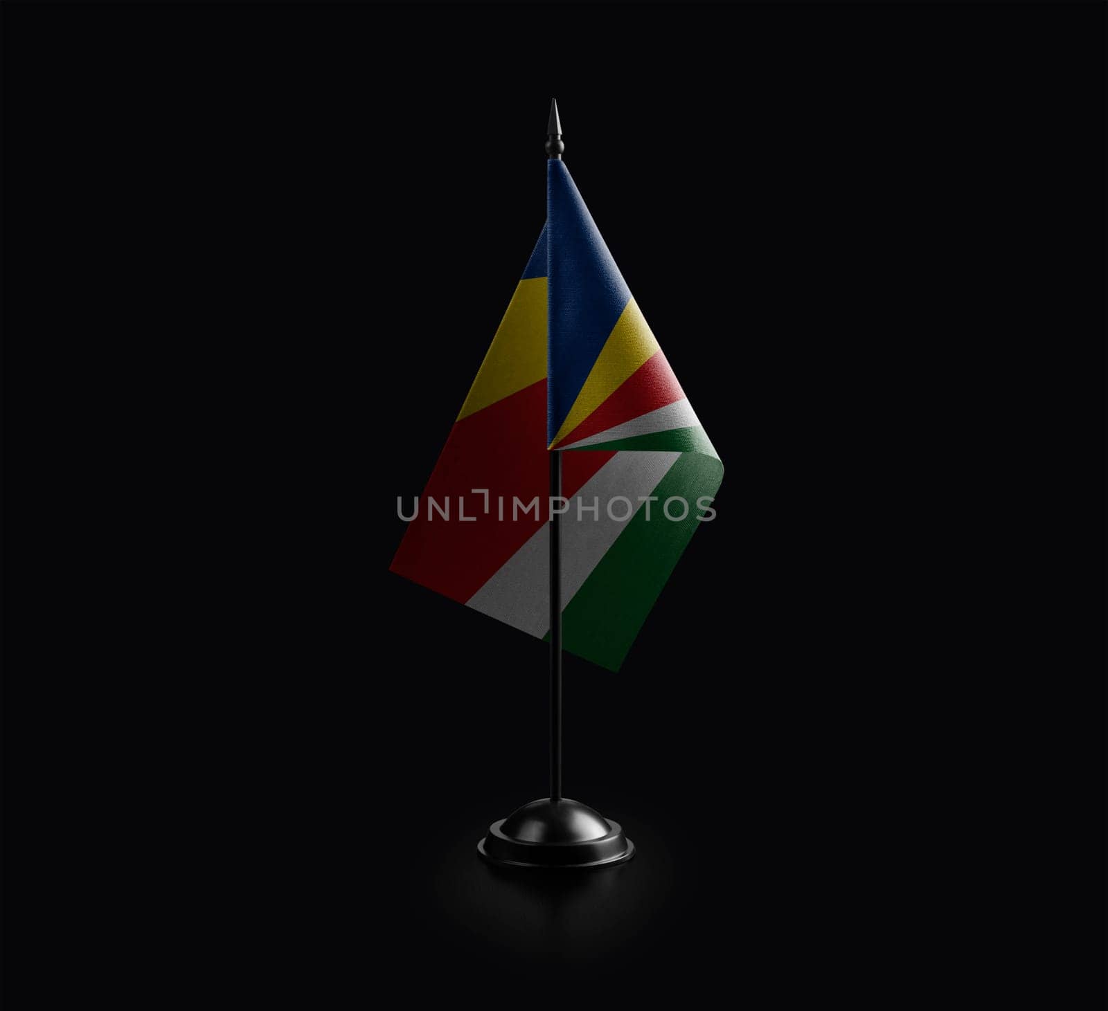 Small national flag of the Seychelles on a black background.