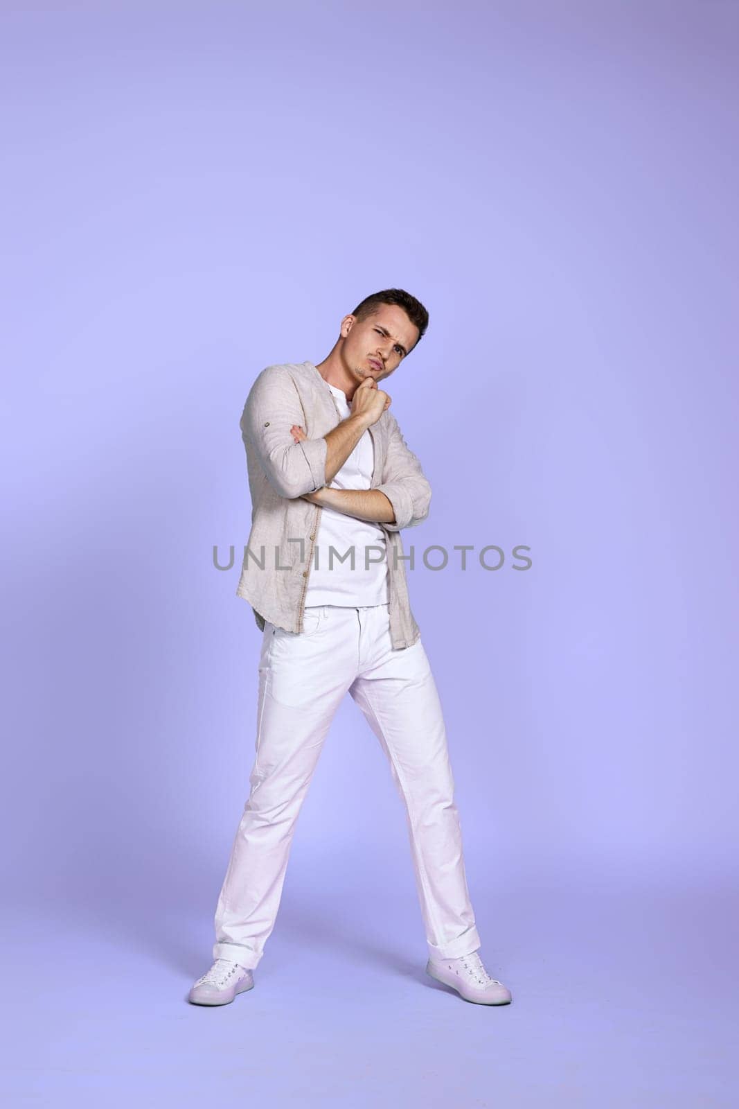 positive dreamy thoughtful young man thinking . Full length