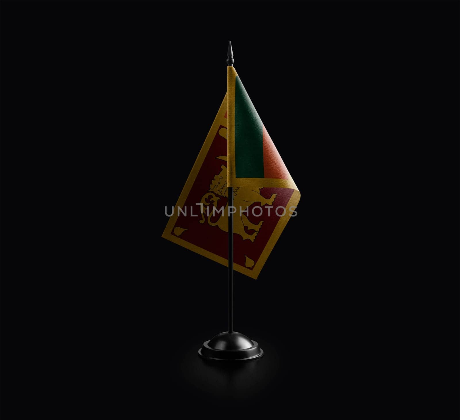 Small national flag of the Sri Lanka on a black background.