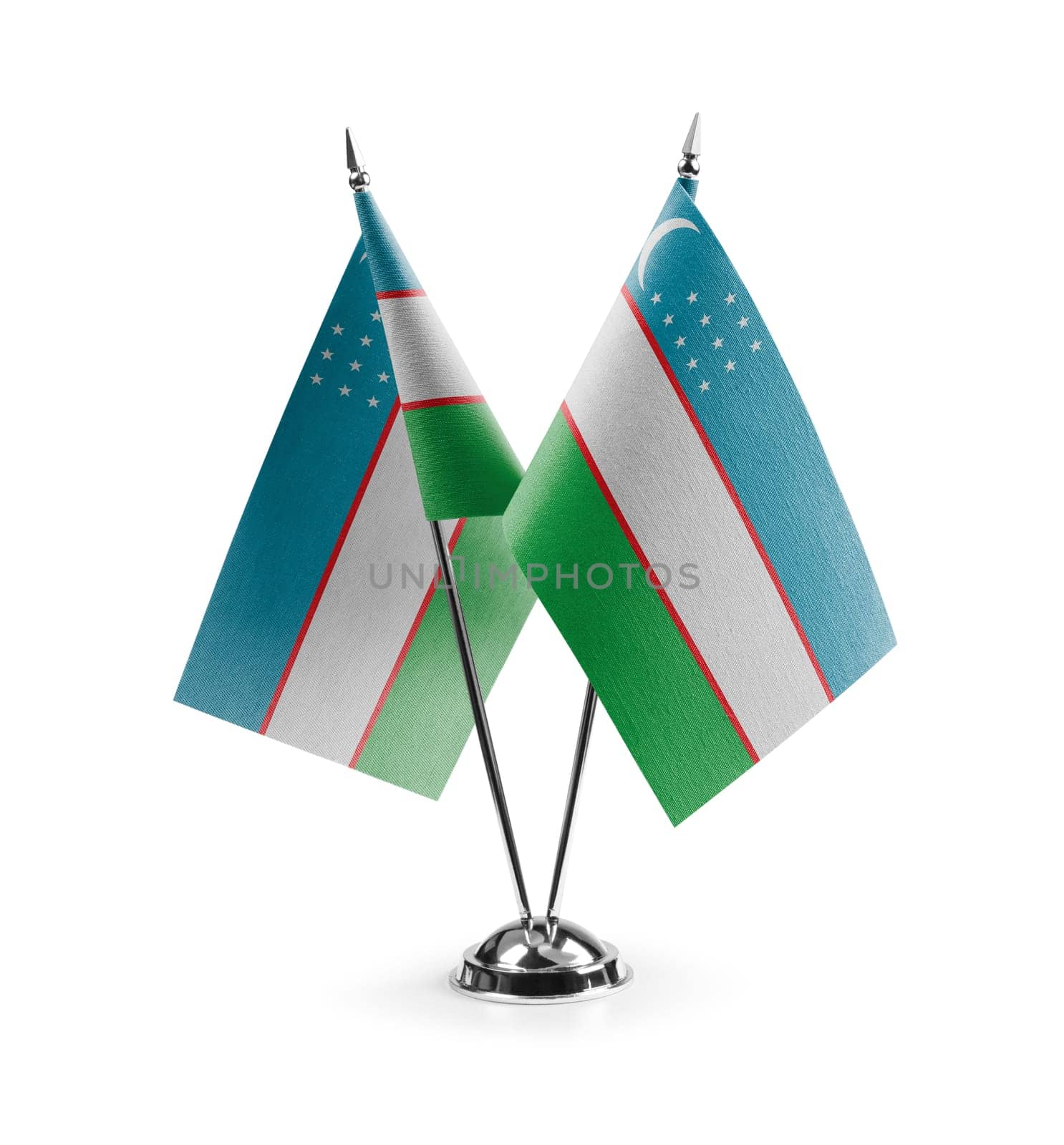 Small national flags of the Uzbekistan on a white background.