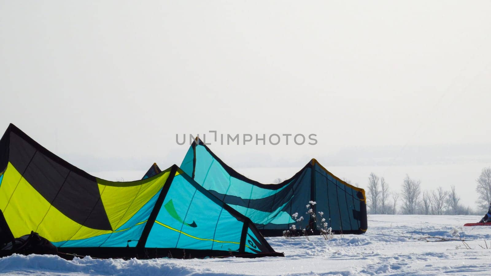 tents stand in the field in winter.
