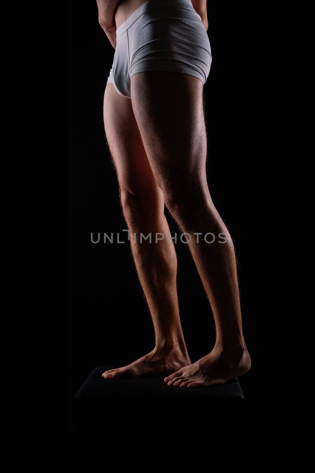 Close-Up of Bodybuilders Legs Ready For Competitive Sport white panties by Zelenin