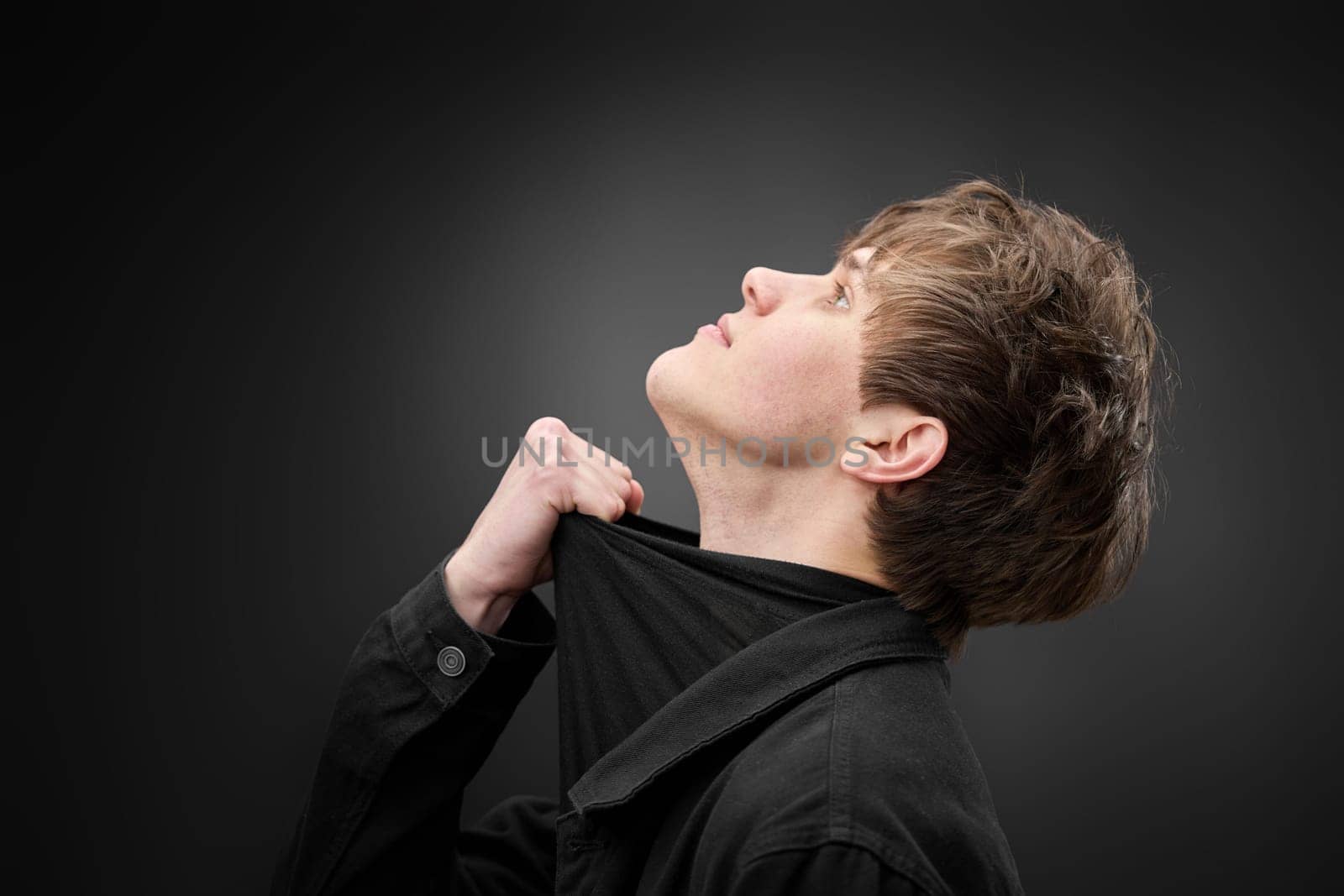 Profile side photo of positive handsome man on black background. copy space