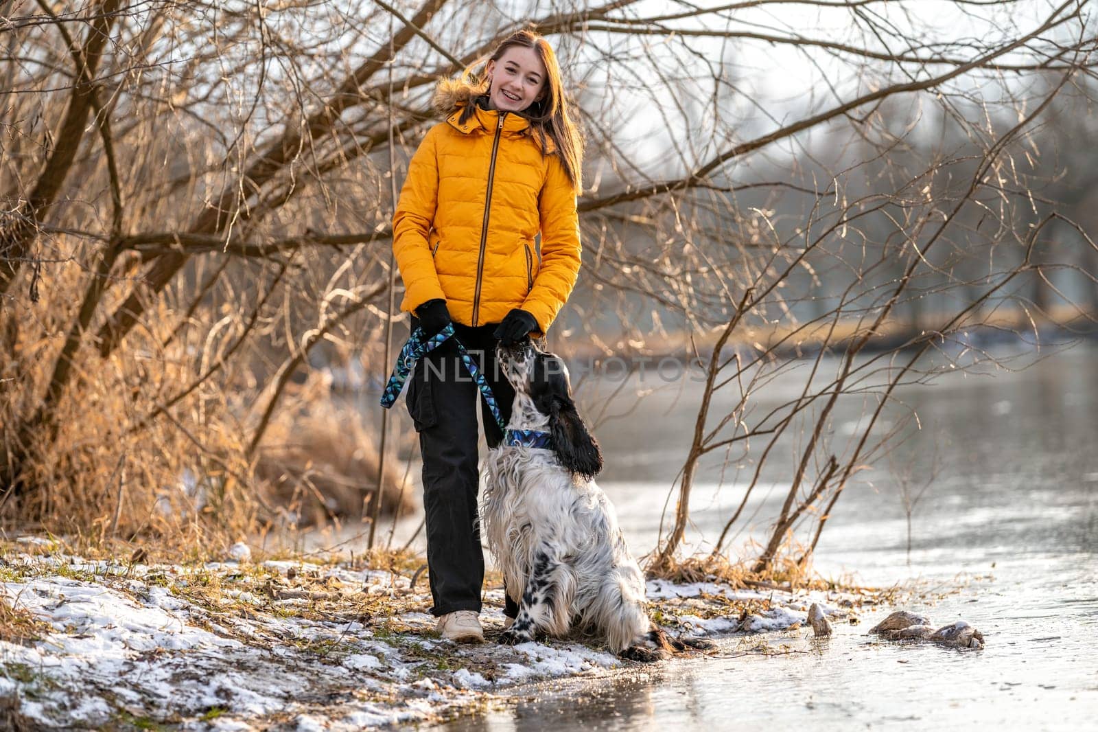 teenager with a dog on a walk in the park. High quality photo