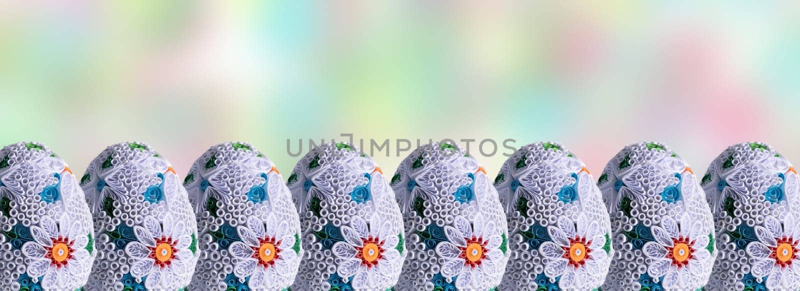 Easter eggs set in a row on a fuzzy colored background. A decoration for the Easter world that allows you to add your own graphic additions.