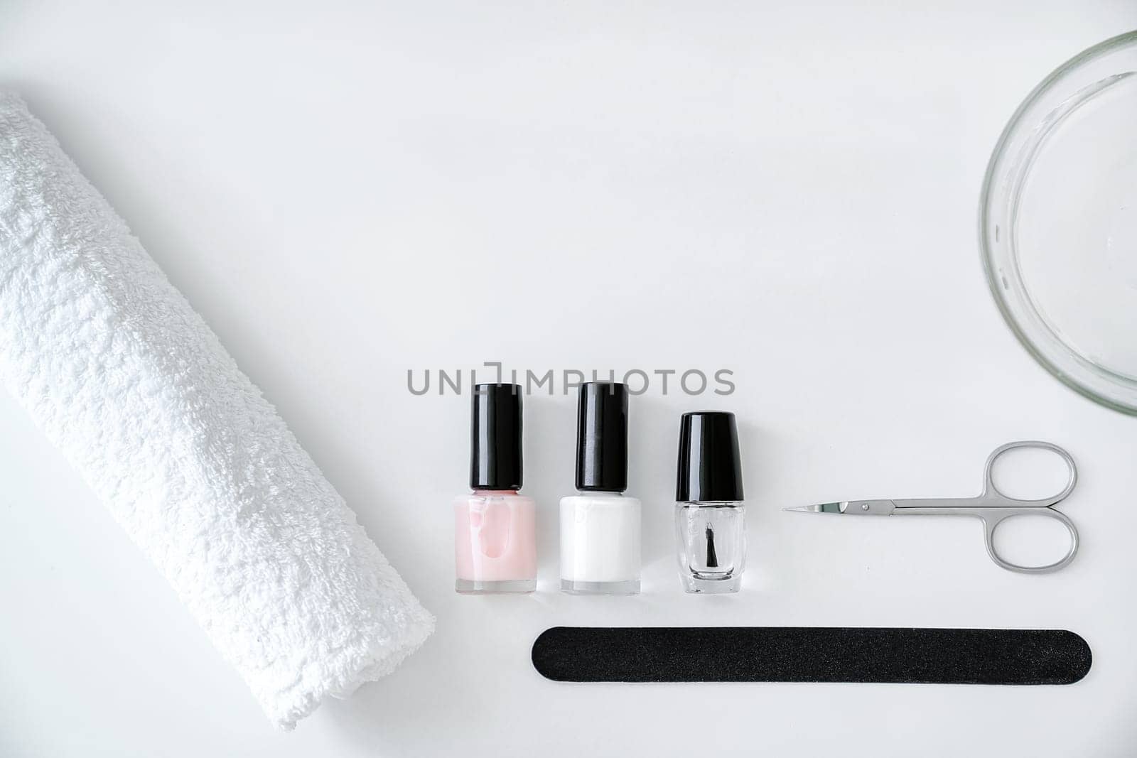 Concept of nail and hand care, manicure accessories on a white background, top view, copy space by Laguna781