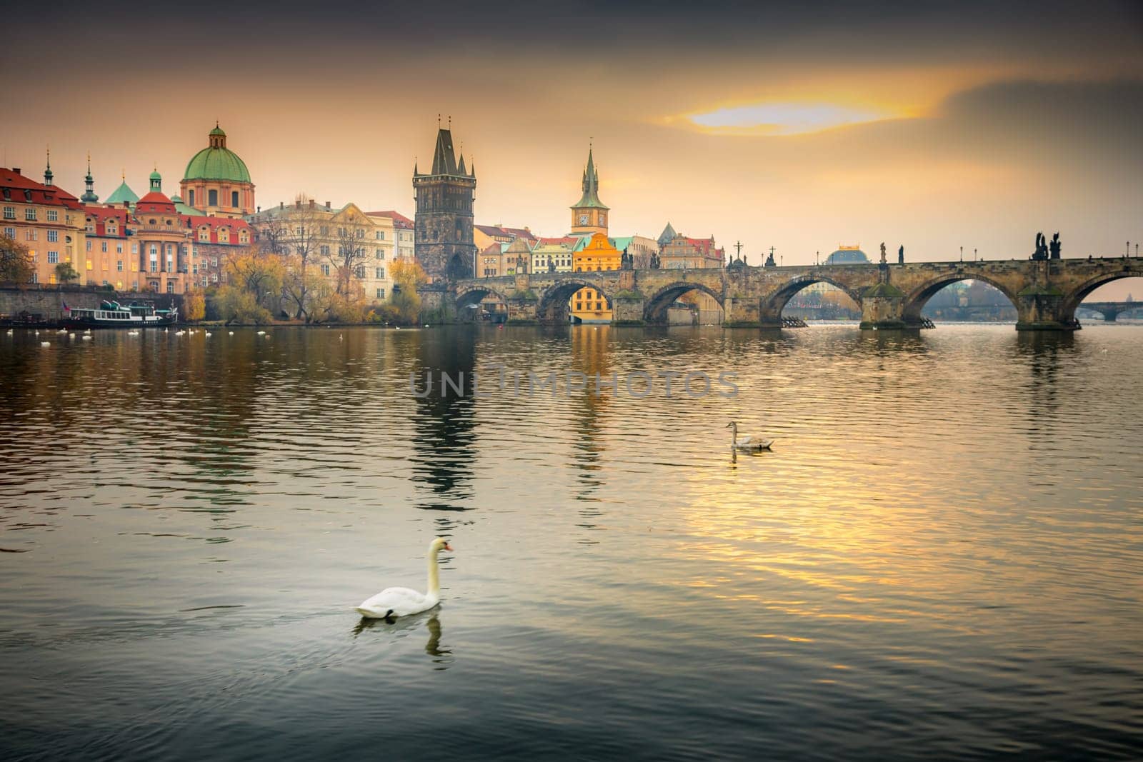 Panoramic view over the cityscape of Prague and Vltava river at dramatic evening, Czech Republic