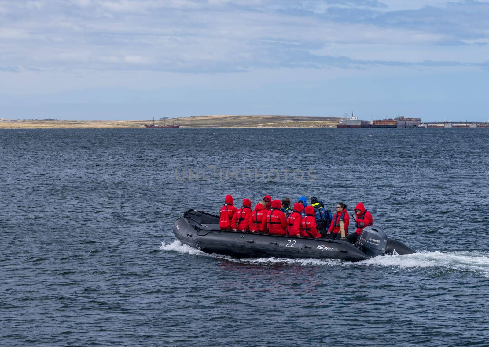 Port Stanley - Falkland Islands: 31 January 2023: Passengers from Silversea Antarctic cruise taking RIB boat into Stanley