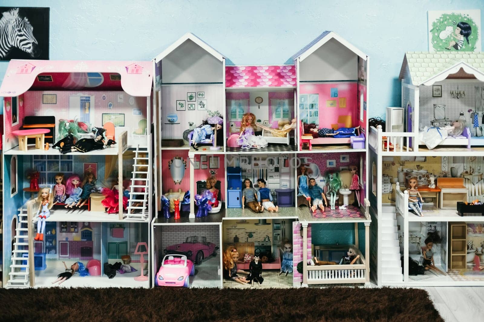 MOSCOW, RUSSIA- JULY 16, 2021: Many dolls Barbie and Ken for play and their house