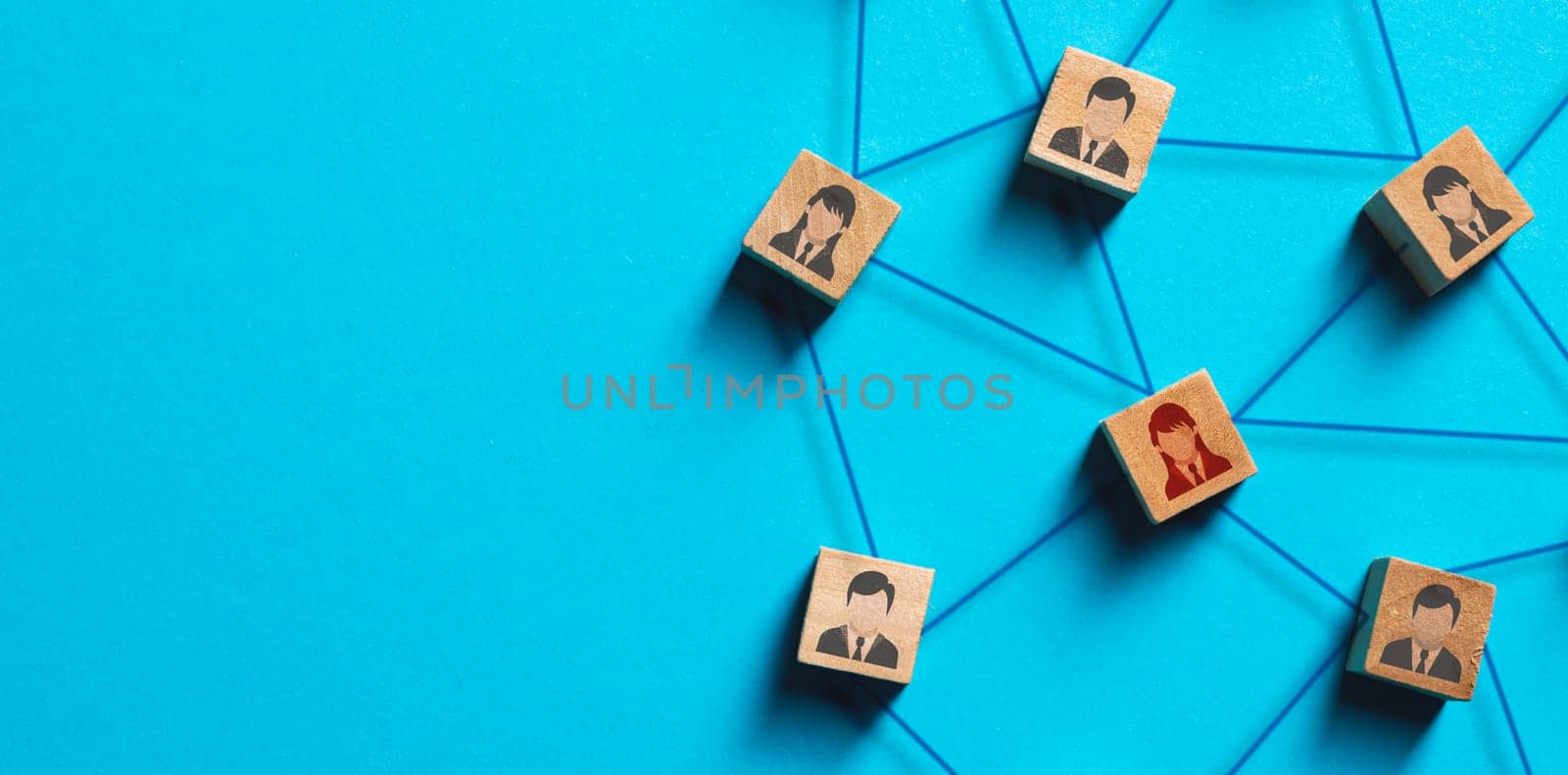 Organization structure, social network and teamwork concept on blue background. Business people icon on wooden cube blocks connecting network of connections by Sonat