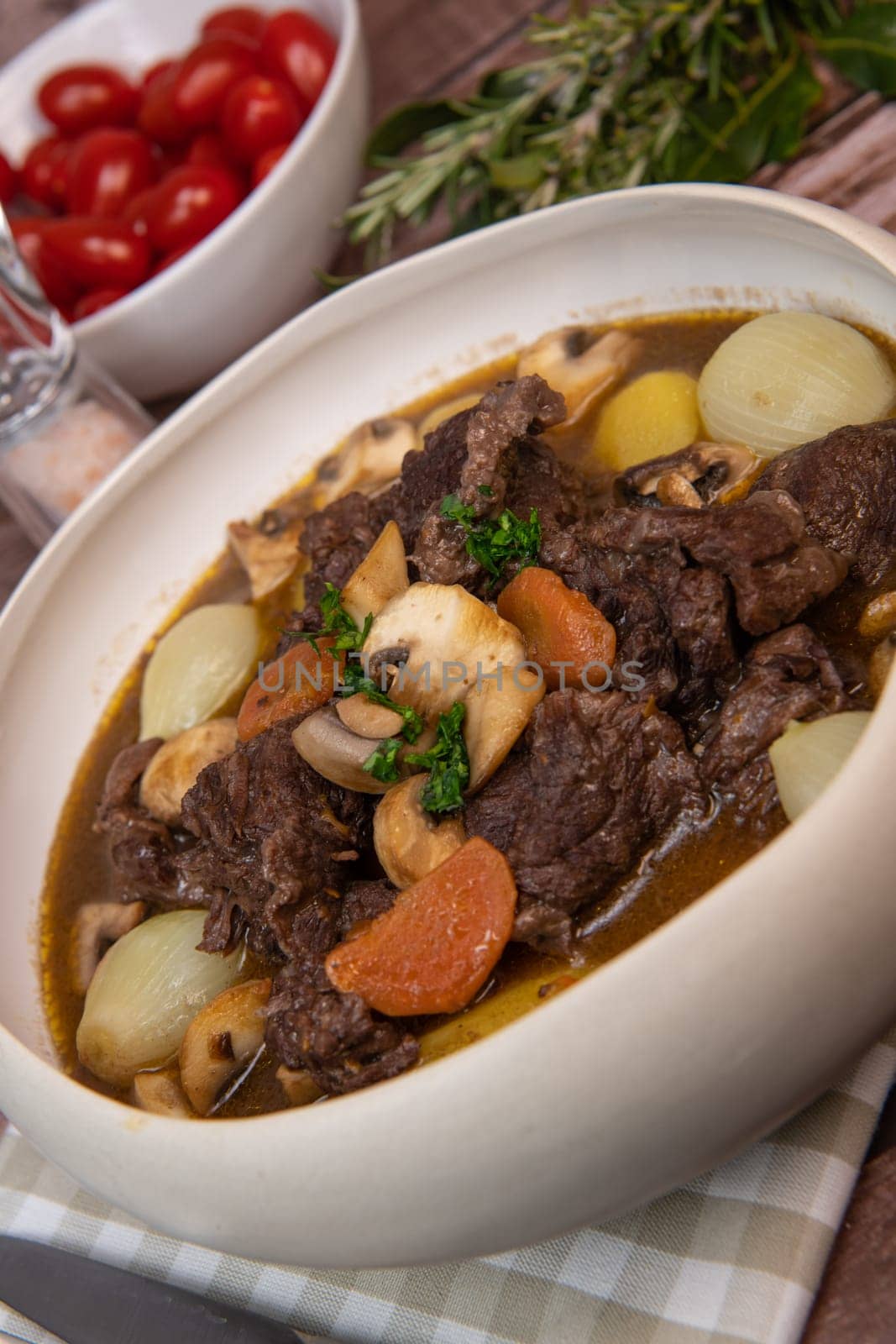 Beef bourguignon recipe, beef stew with wine sauce and vegetables. High quality photo