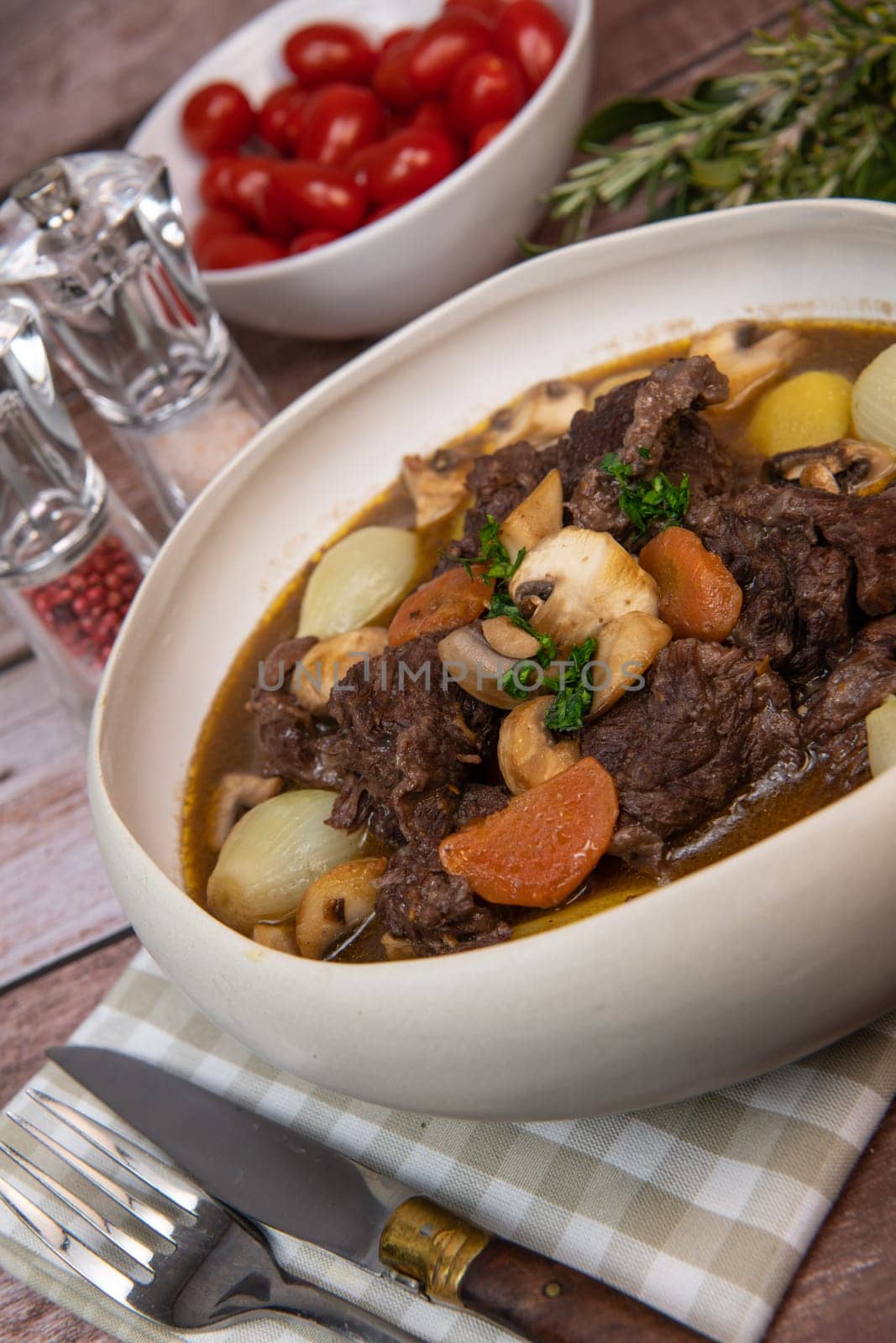 Beef bourguignon recipe, beef stew with wine sauce and vegetables. High quality photo